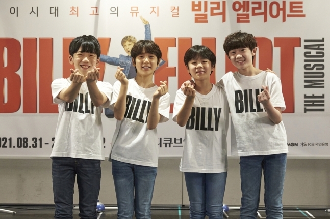 The four children actors who play Billy in musical “Billy Elliot,” from left, Lee Woo-jin, Kim Shi-hoon, Joo Hyun-joon and Jeon Kang-hyuk pose for photos during an online press event held Wednesday. (Seensee Company)