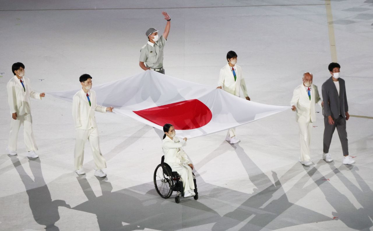 Athletes from Japan carry the national flag of Japan into the Olympic Stadium at the start of the Paralympic Opening Ceremony Tokyo 2020 Paralympic Games in Tokyo, Tuesday. (Reuters-Yonhap)