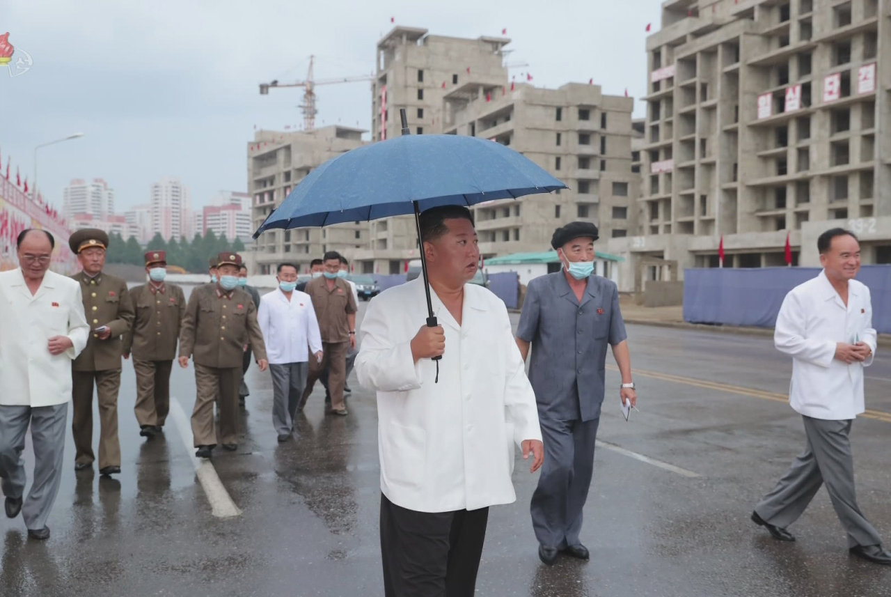 North Korean leader Kim Jong-un inspects construction sites for apartments in Pyongyang on August 21, 2021. (KCNA-Yonhap)