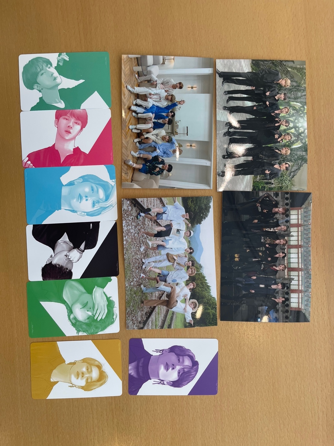 Photo cards and hand-printed pictures of boy band BTS are displayed on the table. (Kweon Ha-bin/The Korea Herald)