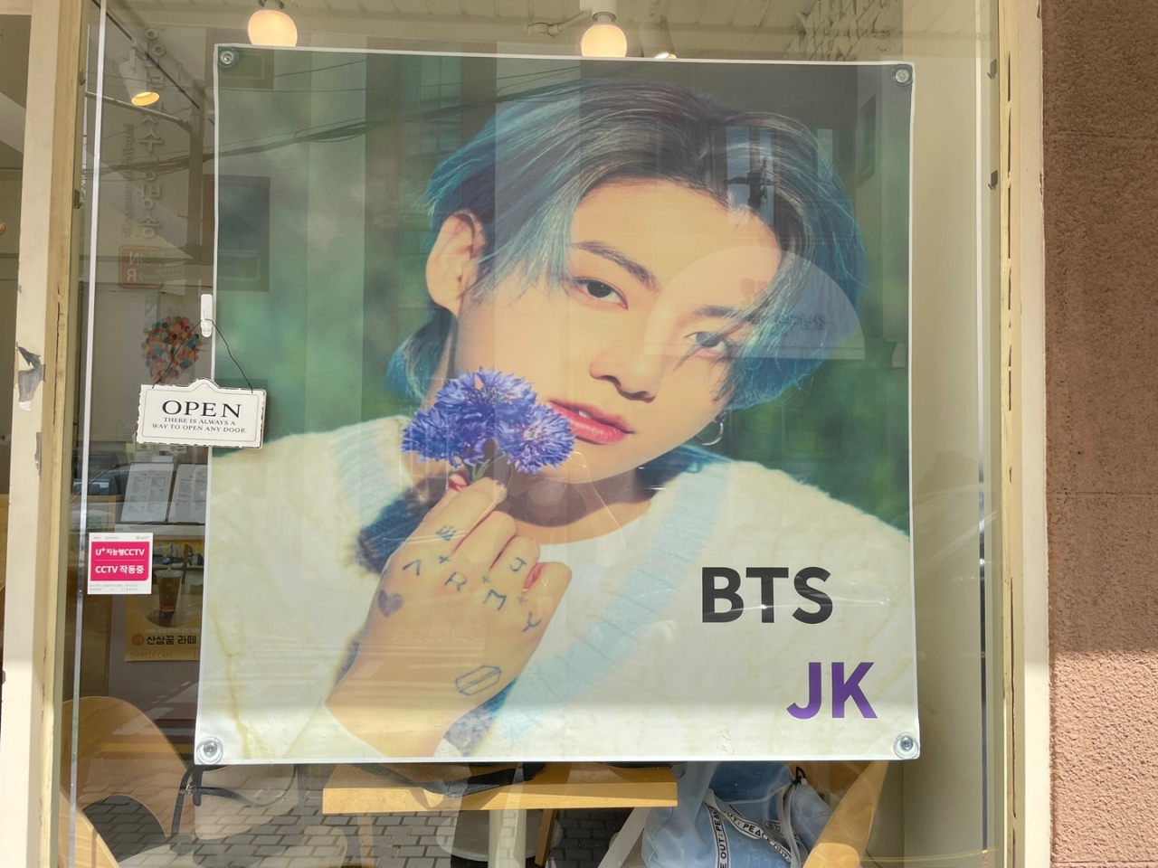 A hanging banner of Jung-kook’s photoshoot is displayed at the entrance to welcome fans. (Kweon Ha-bin/The Korea Herald)
