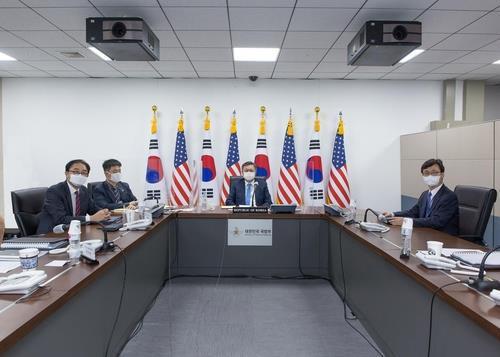 This September 2020 file photo, provided by the defense ministry, shows South Korean officials during the biannual 18th Korea-US Integrated Defense Dialogue (KIDD) held via a videoconference. (Yonhap)