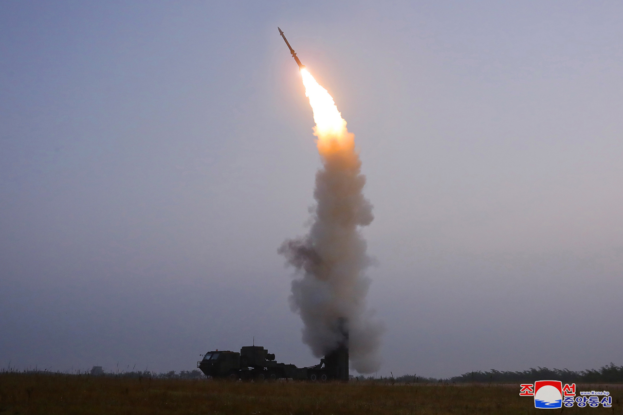 North Korea fires an anti-aircraft missile Thursday. (KCNA-Yonhap)