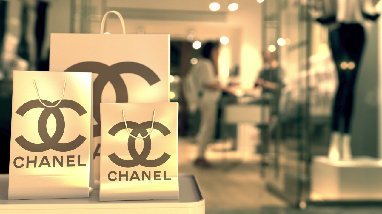 Shopping bags with Chanel logo on display at a store. (123rf)