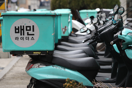 Delivery motorbikes are parked in a rider center in Seoul. (Yonhap)