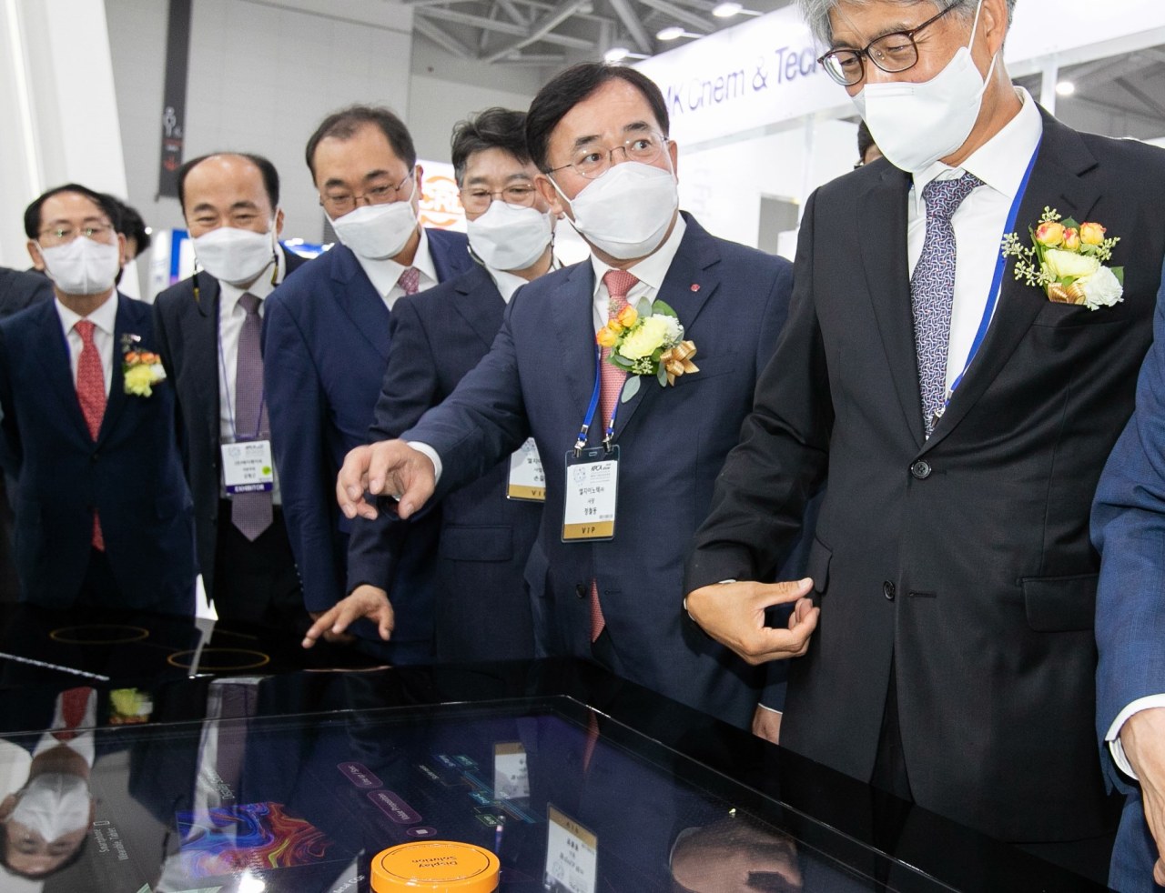 CEO Jeong Cheol-dong (second from right) looks at new products at KPCA show 2021 in Songdo, Incheon, on Wednesday. (LG Innotek)