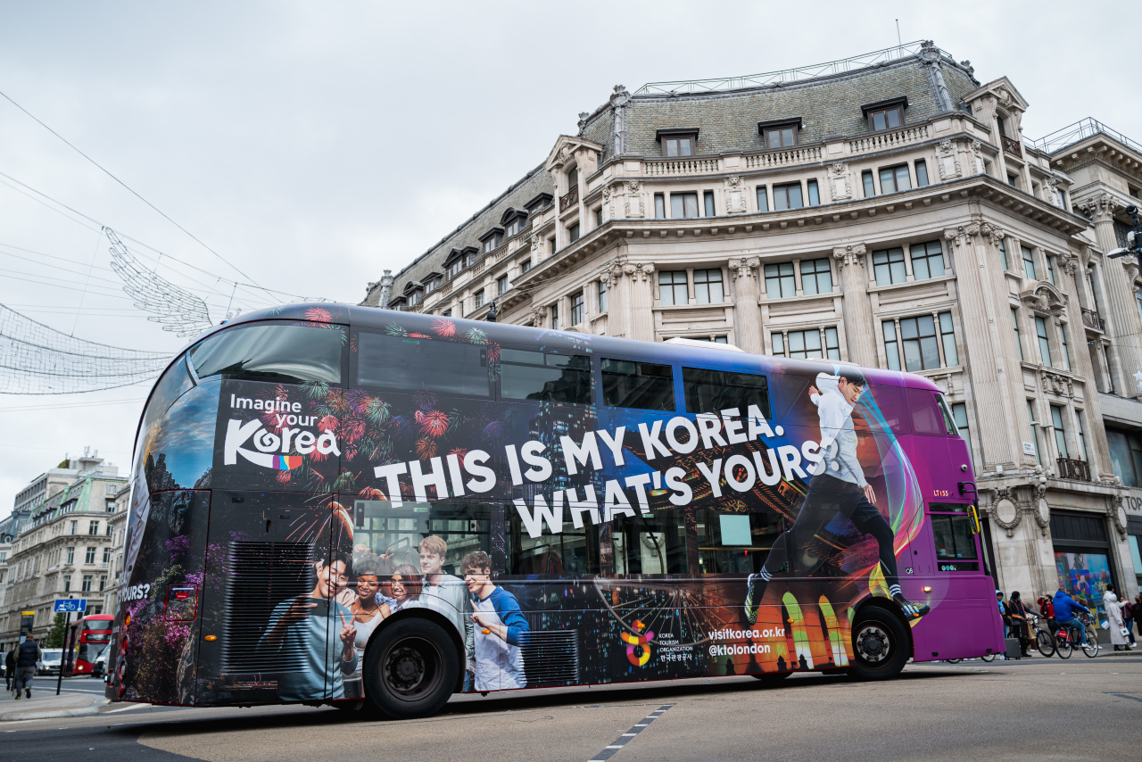 This image shows a British double-decker bus covered with a promotional image for South Korea as a tourist destination featuring football star Son Heung-min. (Culture Ministry)