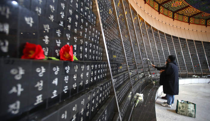 Bereaved families of the victims of the Jeju April 3 incident visit a memorial hall at the Jeju 4.3 Peace Park. (Yonhap)