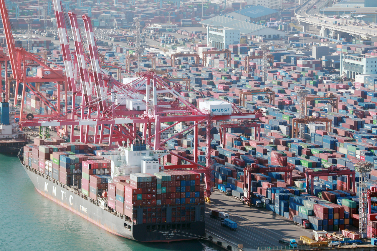 This photo, taken Tuesday, shows stacks of containers at a port in South Korea's southeastern city of Busan. (Yonhap)