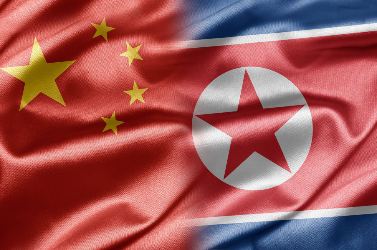 Flags of China and North Korea (123rf)