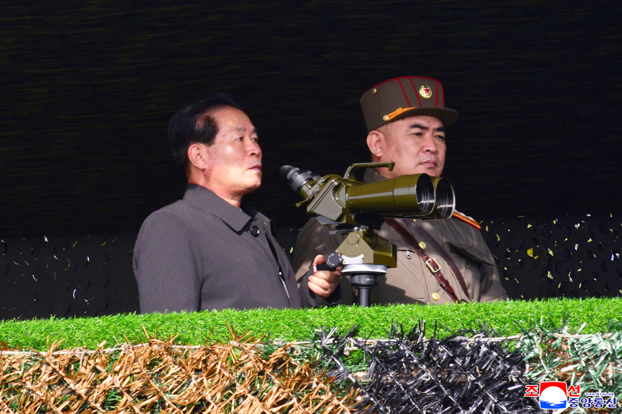Pak Jong-chon (L), a member of the Presidium of the Politburo of North Korea's ruling Workers' Party, presides over an artillery fire competition last Saturday, in this photo released by the North's official Korean Central News Agency the next day. (KNCA-Yonhap)
