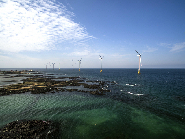 An aerial view of wind turbines off west coast of Jeju Island under Tamra Offshore Wind Power, which has a combined 30-megawatt in power capacity. The offshore wind farm is the first commercial one to operate in South Korea. (Korea South-East Power Co.)