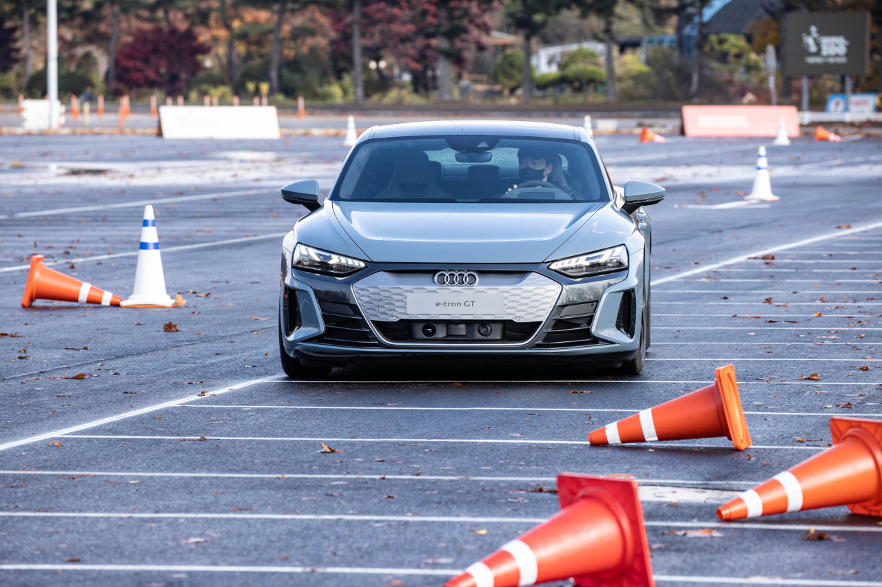 The Audi RS e-tron GT is test-driven in a parking lot at Seoul Grand Park in Gwacheon, Gyeonggi Province, Thursday. (Audi Korea)
