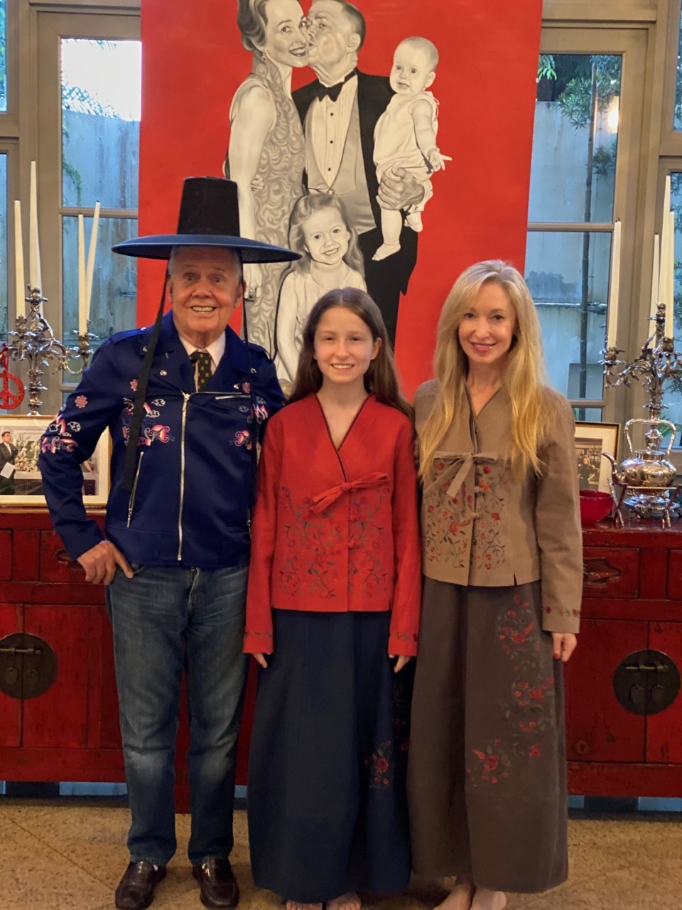 Investor Jim Rogers (left), his wife Paige Parker (right) and their daughter Hilton Augusta pose in contemporary hanbok at their residence in Singapore in this file photo acquired by The Korea Herald on Wednesday. The traditional Korean outfits with a modern touch were gifted to the family after the investor who is known for his keen interest in investing in North Korea appeared in an online talk show hosted by Unification Minister Lee In-young last month. They were designed by Kim Ri-eul, who owns modern hanbok brand Rieul. (Kim Ri-eul)