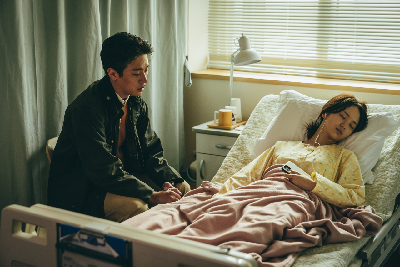 Bae Young-jae (played by Park Jeong-min) and his wife are in agony after hearing his child is bound to go to hell in three days in “Hellbound.” (Netflix)
