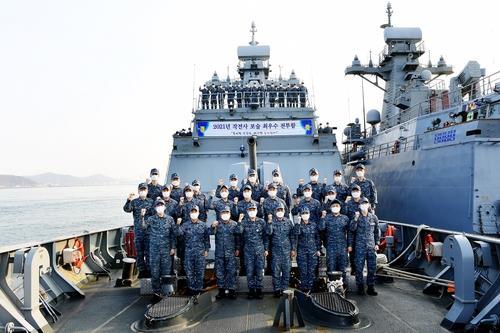 This photo, released on Monday by the Navy, shows sailors of its 2,500-ton frigate, Jeonbuk, posing for a photo. (The Navy)