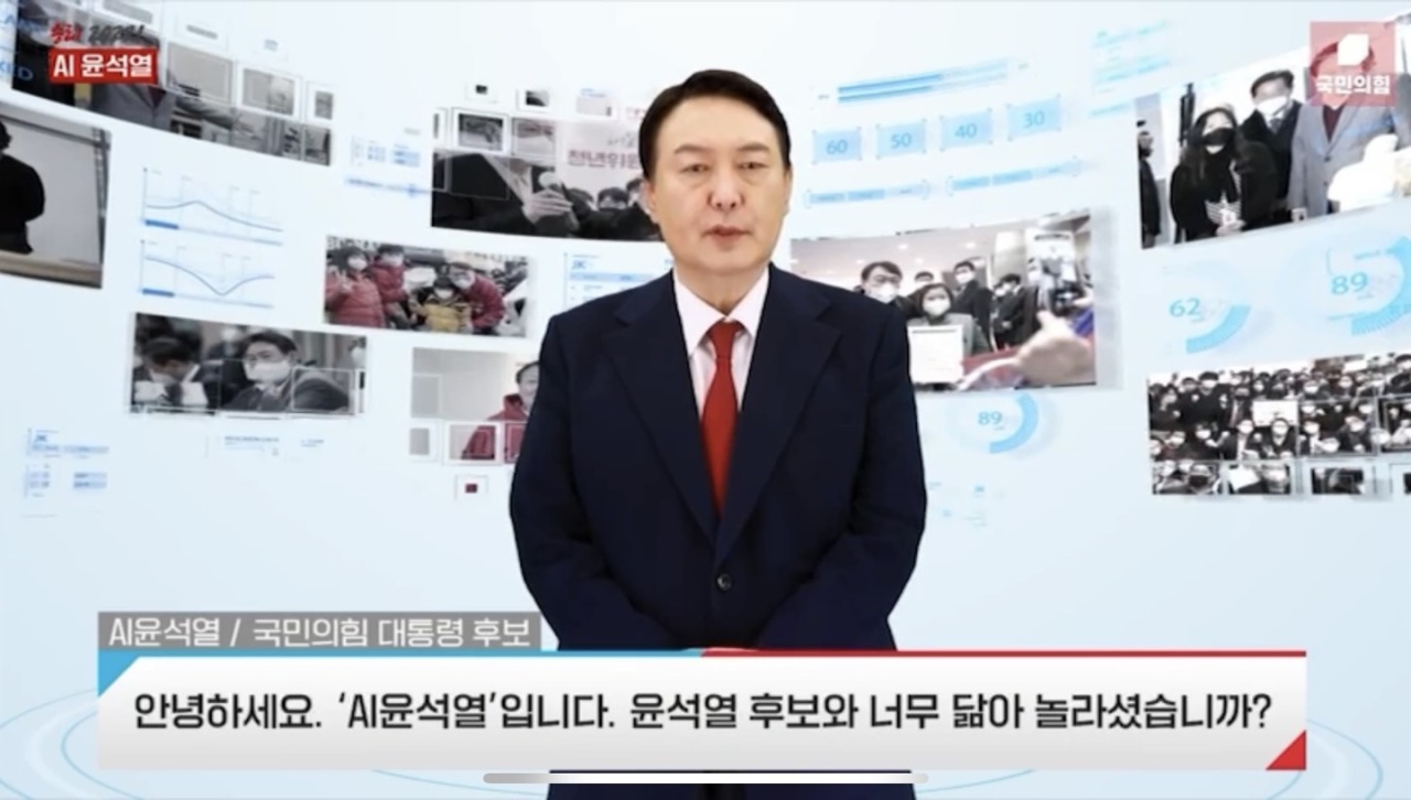 AI Yoon Suk-yeol, a digitally-created character speaks in a 1-minute video revealed at People Power Party election committee’s inauguration ceremony on Monday. The AI character said, “Hello. I am AI Yoon Suk-yeol. Are you surprised because we look alike?” (Screen captured from video)