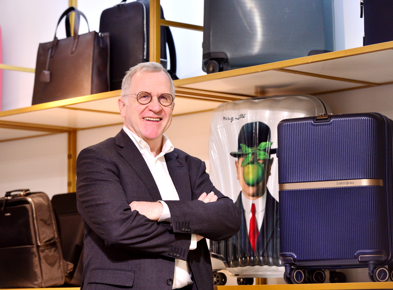 Paul Melkebeke, the president in charge of Samsonite’s Asia-Pacific and Middle East operations, stands next to luggage displayed at the company’s office in Samseong-dong, southern Seoul, Nov. 25. (Park Hyun-koo/The Korea Herald)