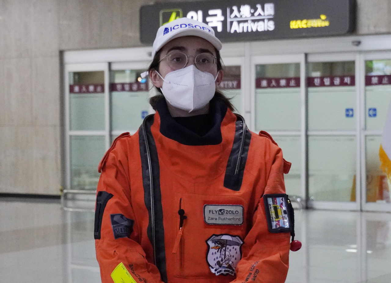 Zara Rutherford, a British-Belgian pilot attempting to become the youngest woman to fly solo around the world, speaks to reporters at Gimpo International Airport in Seoul on Saturday, after making a stop in South Korea during her journey. (Yonhap)