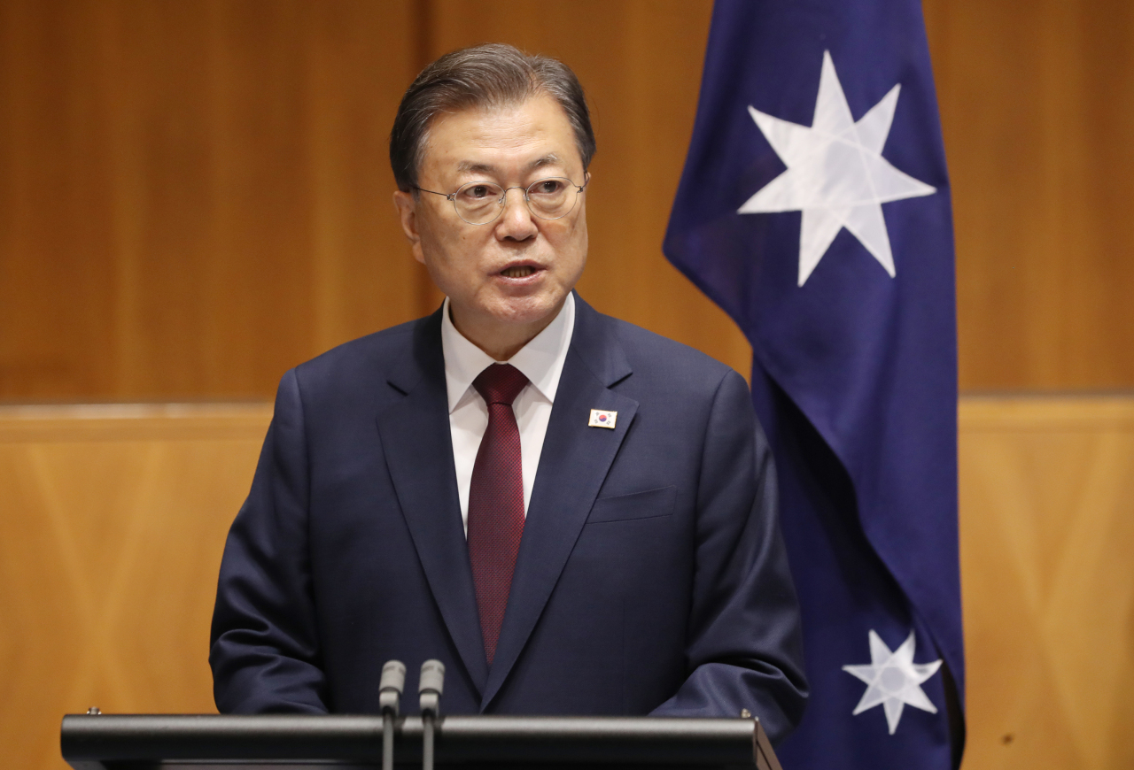 President Moon Jae-in speaks at a joint press conference with Australian Prime Minister Scott Morrison at the Parliament House in Canberra on Monday. (Yonhap)