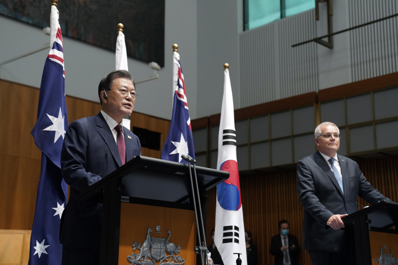 President Moon Jae-in, who is on a state visit to Australia, answers questions at a press conference for the leaders of South Korea-Australia held at the Supreme Council room in Canberra’s National Assembly building on Monday. (Yonhap)