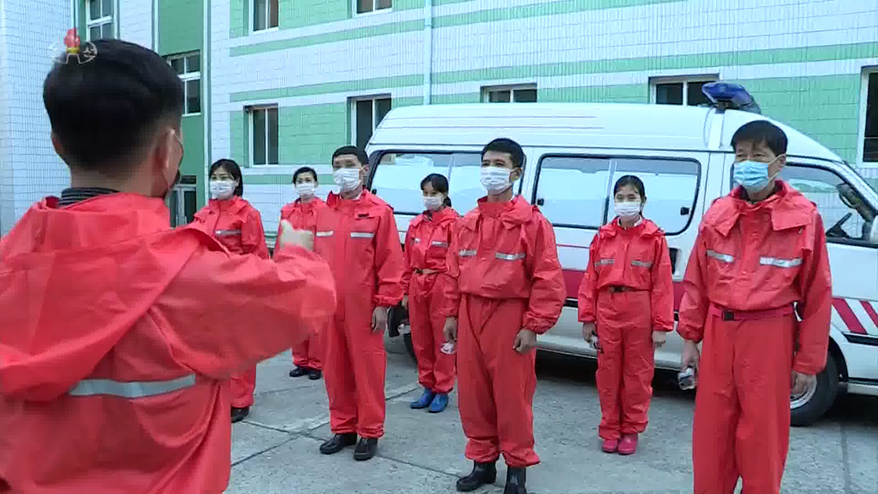 This undated image, captured from North Korea's state TV on Dec. 1, 2021, shows its quarantine workers. (Captured from North Korea's state TV)