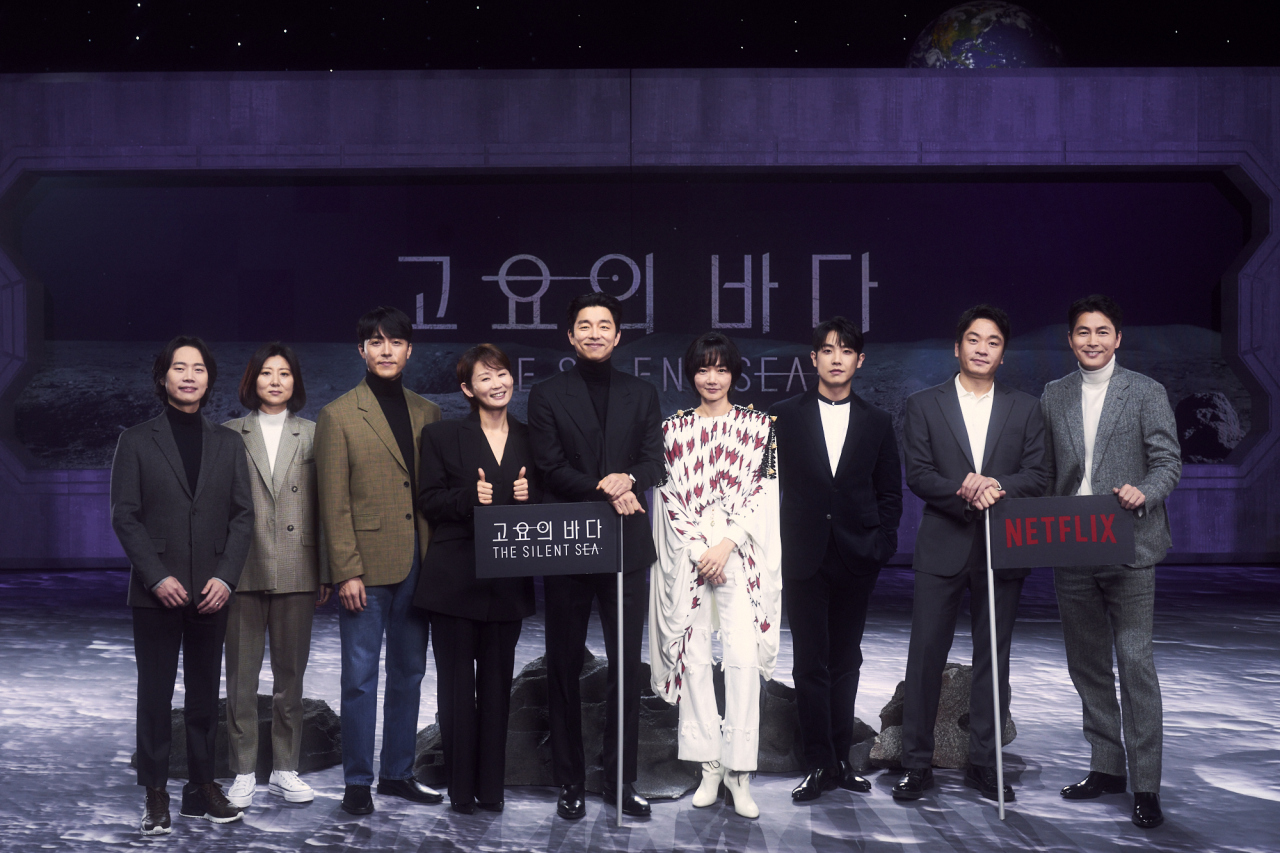 From left: Director Choi Hang-yong, screenwriter Park Eun-gyo, actors Lee Moo-saeng, Kim Sun-young, Gong Yoo, Bae Doo-na, Lee Joon and Lee Sung-wook and producer Jung Woo-sung pose for photos before an online press conference Wednesday. (Netflix)