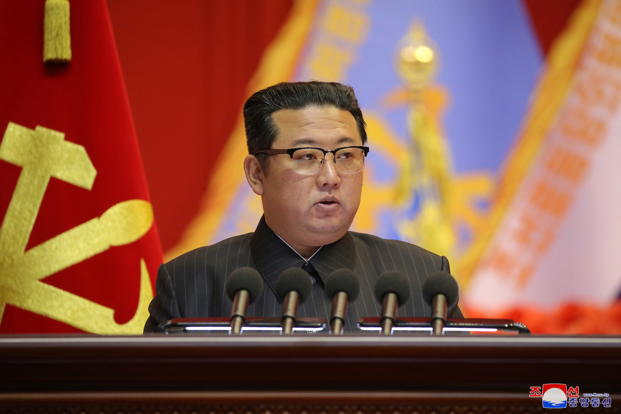 This photo, released by the Korean Central News Agency on Dec. 7, 2021, shows North Korean leader Kim Jong-un presiding over a meeting of the North Korean Army's educationists at the April 25 House of Culture in Pyongyang on Dec. 4 and 5. (KCNA)