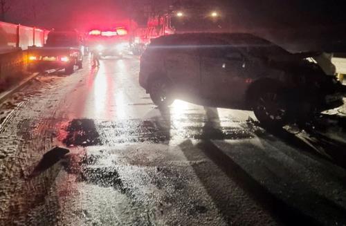 This photo, provided by a fire station in Asan, about 85 kilometers south of Seoul, shows the scene of a car crash caused by icy roads on Monday. (Asan fire station)