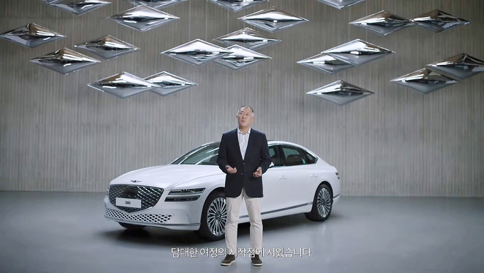 A screen capture of Hyundai Motor Group Chairman Chung Euisun speaking on its luxury Genesis brand’s vision to go completely eco-friendly for its lineup from 2025 (HMG Youtube)
