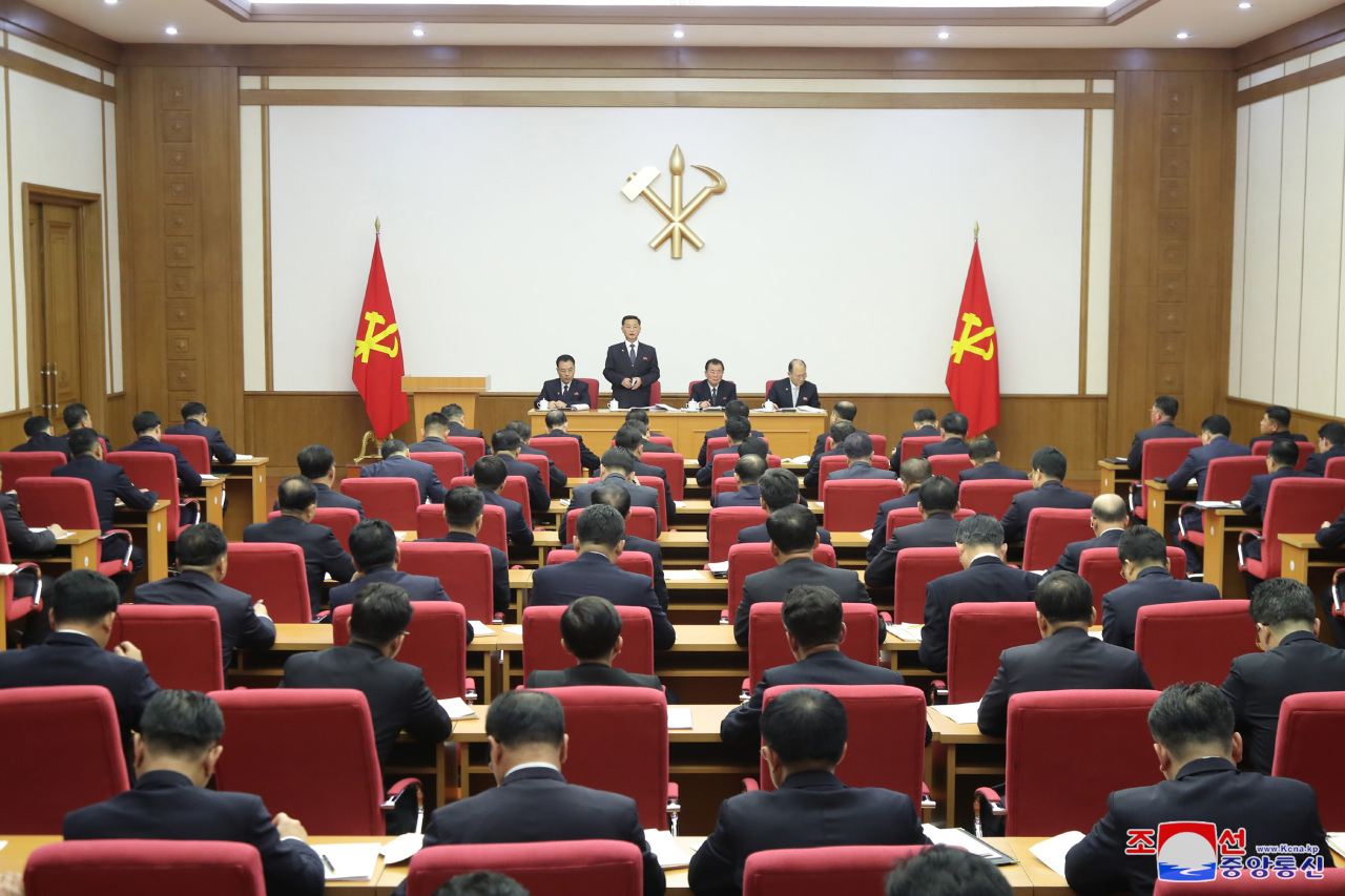 North Korean Premier Kim Tok-hun (standing) speaks during a plenary session of the central committee of North Korea's ruling Workers' Party on the event's third day on Wednesday, in this photo released by the Korean Central News Agency the next day. (KCNA)