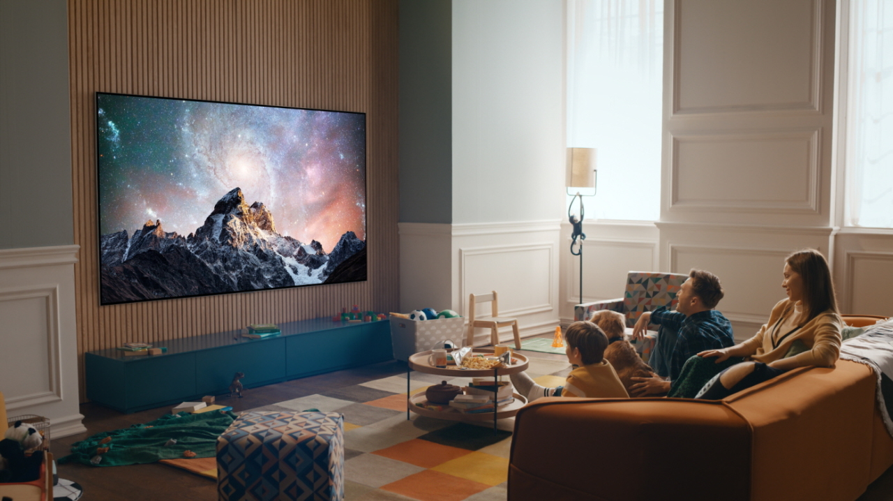 A promotional image displays a 97-inch OLED TV in a living room. (LG Electronics)
