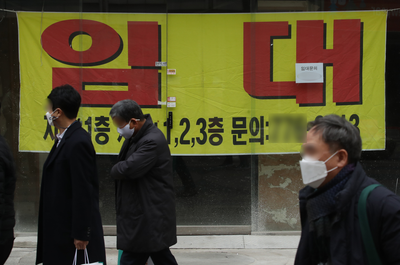 This photo, taken Wednesday, shows a for lease sign put up at a store in the shopping district of Myeongdong. (Yonhap).