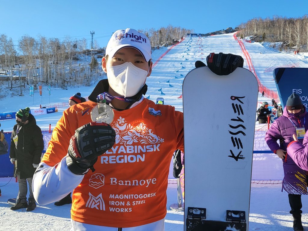This Dec. 11, 2021, file photo provided by the Korea Ski Association shows South Korean alpine snowboarder Lee Sang-ho after his second-place finish in the men's parallel slalom at the International Ski Federation Snowboard World Cup in Bannoye, Russia. (Korea Ski Association)
