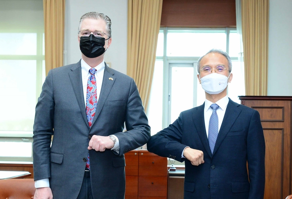In this file photo released by South Korea's Ministry of Foreign Affairs on Nov. 11, 2021, Daniel Kritenbrink (L), the US assistant secretary of state for East Asian and Pacific affairs, bumps elbows with his South Korean counterpart, Yeo Seung-bae, deputy foreign minister for political affairs, during their meeting in Seoul. (Foreign ministry)