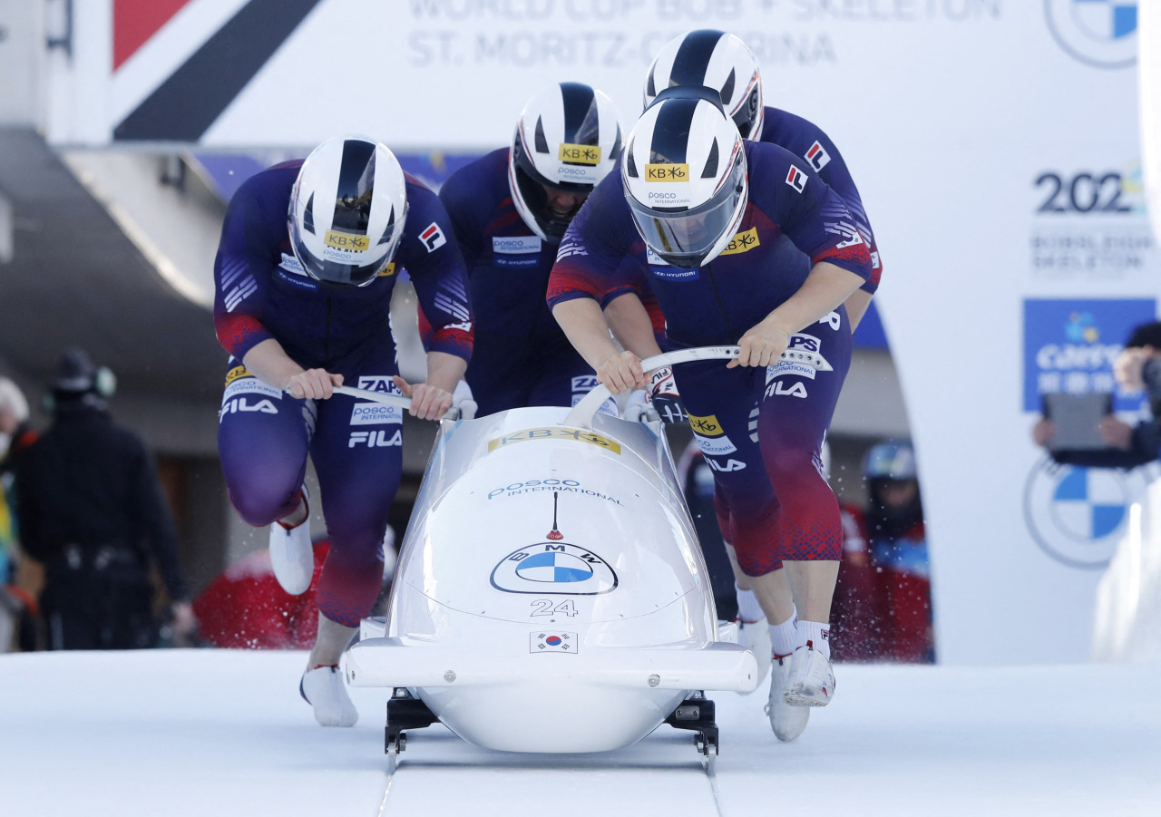 In this Reuters photo, the South Korean four-man bobsleigh team, piloted by Won Yun-jong (front), takes a start during the International Bobsleigh & Skeleton Federation (IBSF) World Cup in St. Moritz, Switzerland, on Sunday. (Reuters)