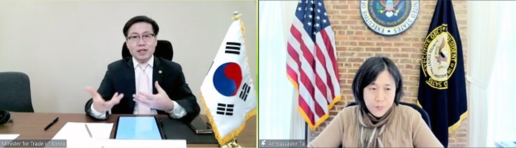 This image, provided by South Korea's industry ministry on Wednesday, shows South Korean Trade Minister Yeo Han-koo (L) speaking with US Trade Representative (USTR) Katherine Tai during a teleconference earlier in the day. (South Korea's industry ministry)