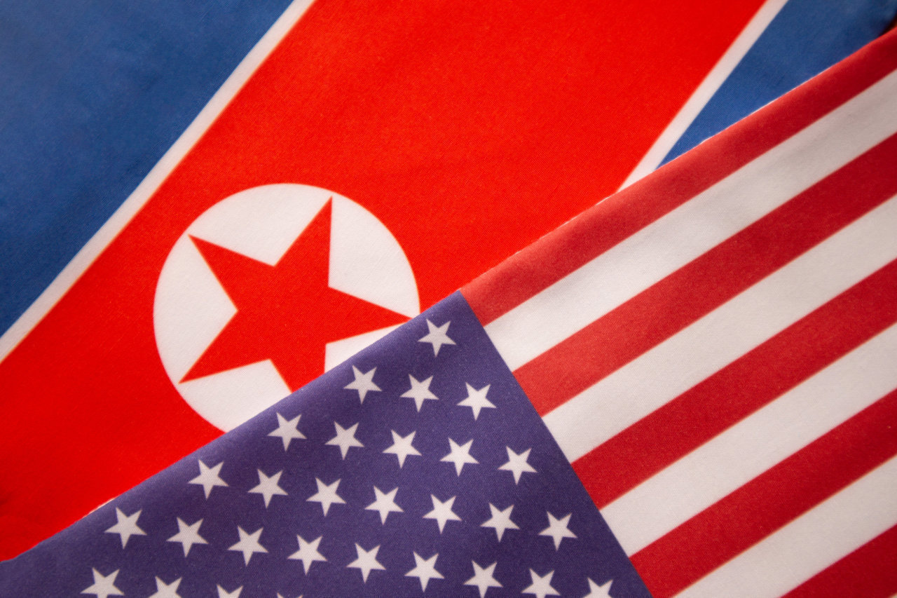 Flags of North Korea and the US (123rf)
