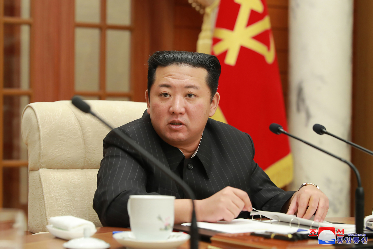 North Korean leader Kim Jong-un presides over a politburo meeting of the Workers' Party at the headquarters of the party's Central Committee in Pyongyang on Wednesday, in this photo released by the North's official Korean Central News Agency. Kim ordered officials to reconsider all trust-building measures with the United States, instructing them to mull resuming all activities temporarily suspended. North Korea has maintained a self-imposed moratorium on nuclear and ICBM testing since late 2017. (KNCA-Yonhap)