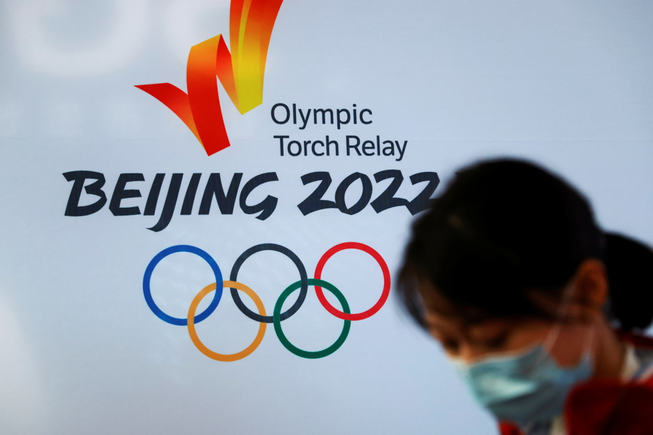 This Associated Press file photo from Dec. 9, 2021, shows the logo for the 2022 Beijing Winter Olympics torch relay posted at the Beijing University of Posts and Communications in Beijing. (AP-Yonhap)
