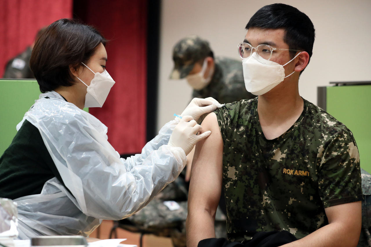 A soldier gets a booster shot at an inoculation center in Yongin, 49 kilometers south of Seoul, in this photo released by the Ministry of National Defense on Dec. 13, 2021. (The Ministry of National Defense)