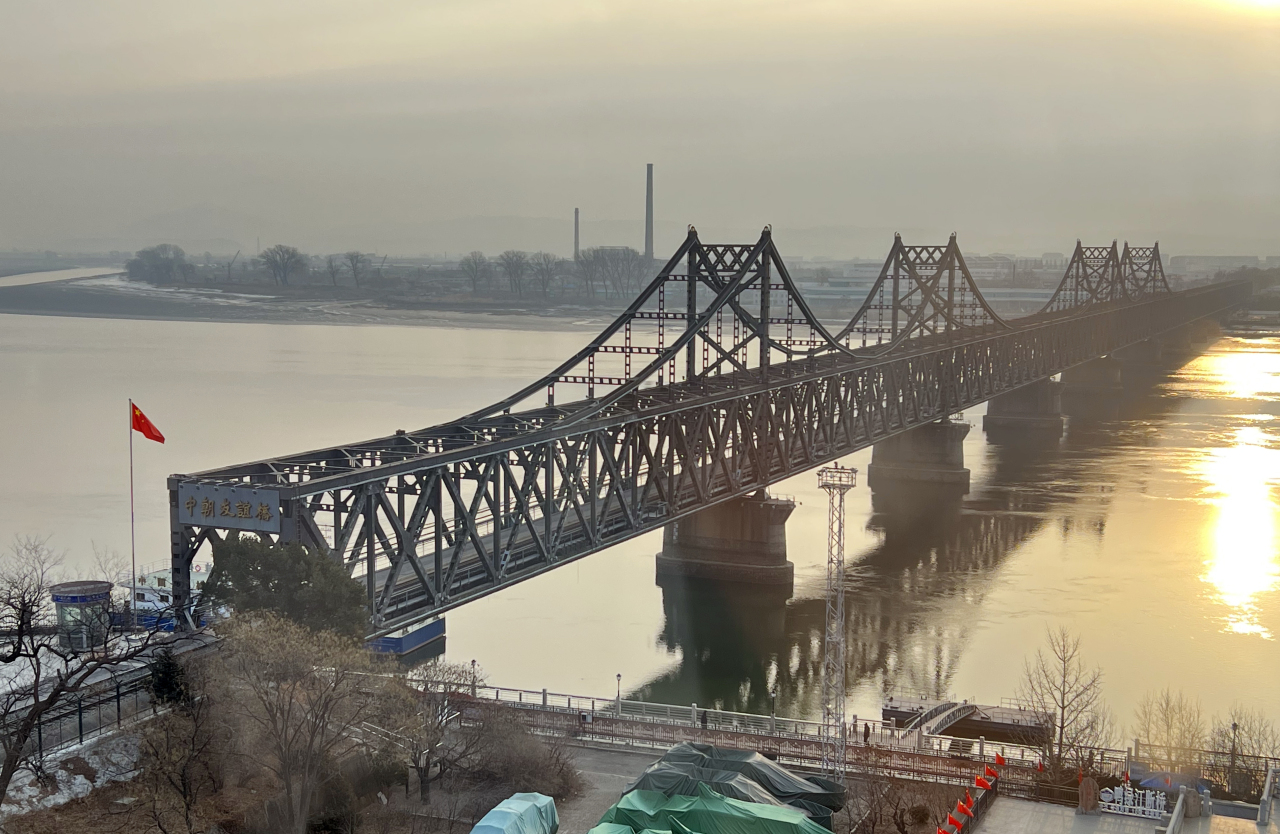 The photo shows a bridge over the Yalu River connecting Sinuiju in North Korea to the Chinese port city of Dandong. (Yonhap)