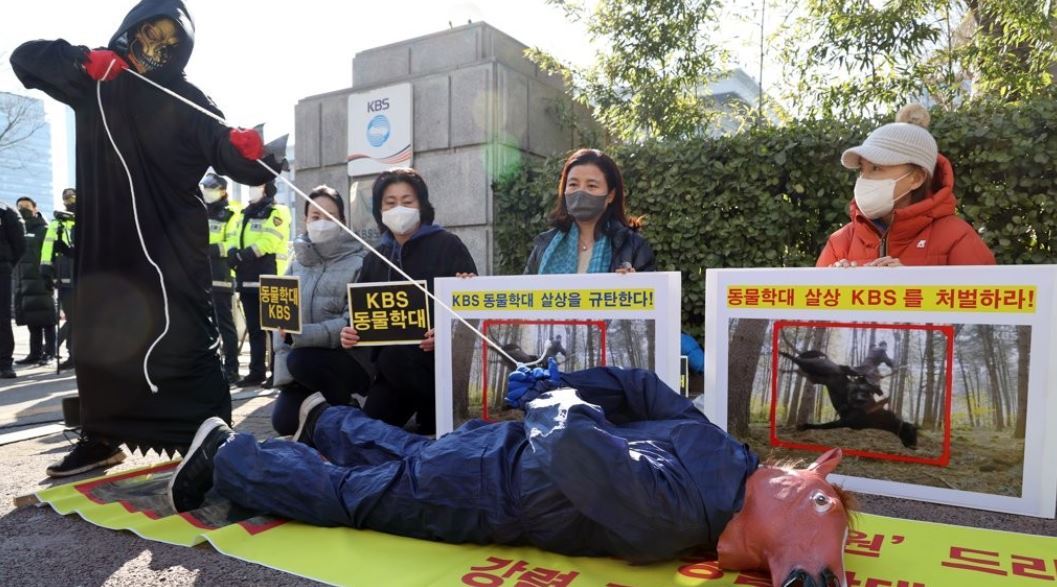A group of animal rights activists holds a protest in front of KBS TV headquarters in Seoul on Jan. 21, 2022, following revelations that a horse used during filming of the TV series 