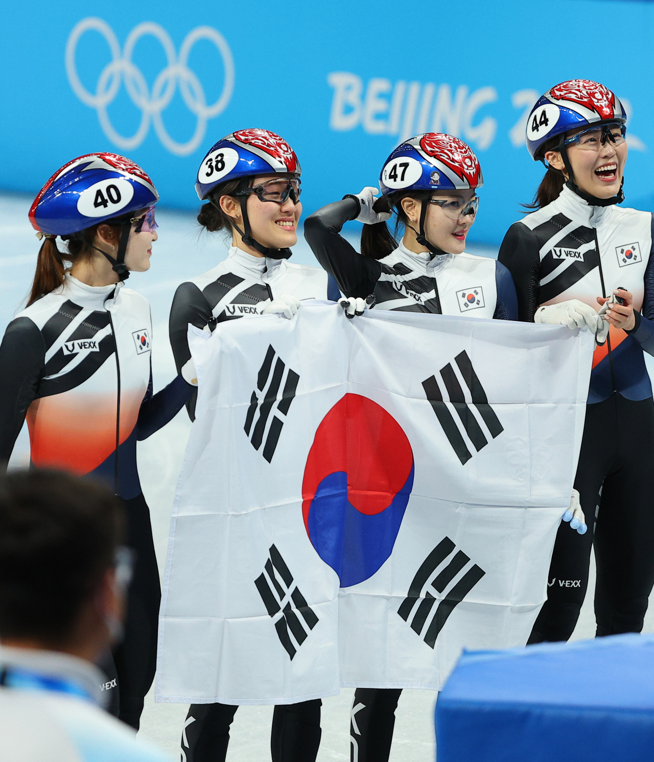 South Korean short track speed skaters Choi Min-jeong, Kim A-lang, Lee Yu-bin and Seo Whi-min celebrate their silver medal in the women's 3,000m relay at the Beijing Winter Olympics at Capital Indoor Stadium in Beijing on Sunday. (Yonhap)