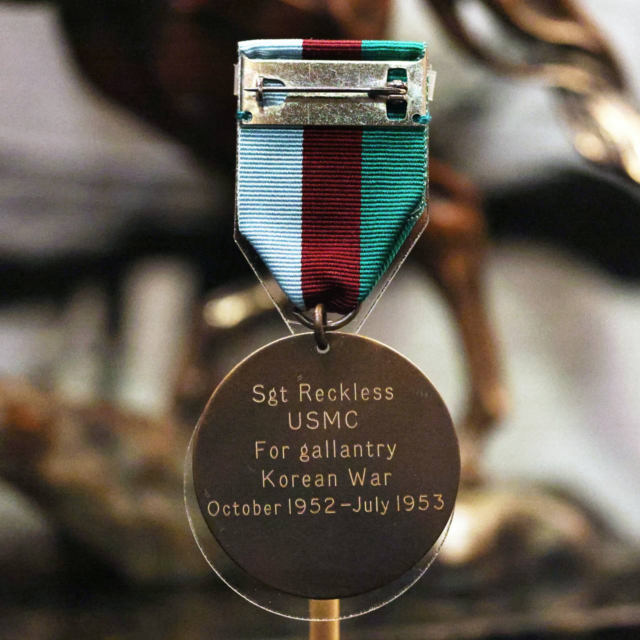 A PDSA Dickin bronze medal awarded to Reckless is on display at the National Museum of the Marine Corps in Triangle, Virginia. Photo @Hyungwon Kang