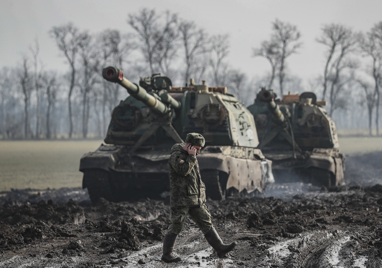 Russian armoured vehicles stand on the road in Rostov region, Russia, Tuesday. (EPA)