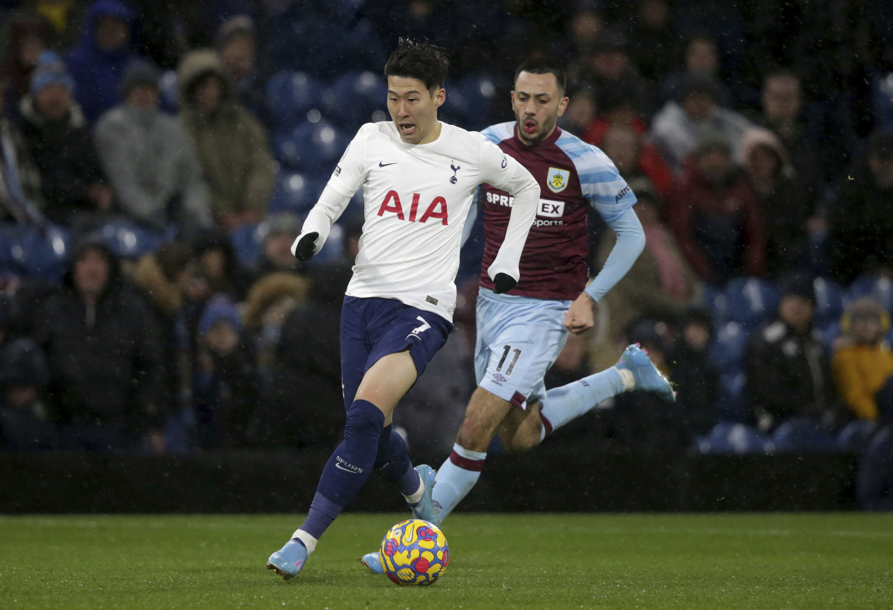 In this Press Association photo via Associated Press, Son Heung-min of Tottenham Hotspur (L) dribbles past Dwight McNeil of Burnley during the clubs' Premier League match at Turf Moor in Burnley, England, on Wednesday. (Yonhap)