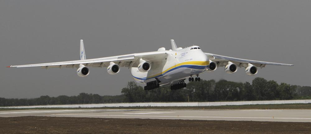 The Ukrainian Antonov-225 Mriya (Dream), the world's heaviest and largest aircraft, makes a test landing at the new runway at the airport in Donetsk, Ukraine on July 26, 2011. Ukraine's defense industry conglomerate says the world's largest plane that was in regular operation was heavily damaged in fighting with Russian troops at the airport outside Kyiv where it was parked. (AP Photo/Sergey Vaganov, File)