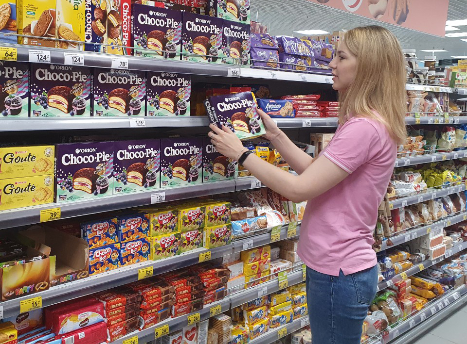 A customer looks at Orion’s products at a supermarket in Russia. (Orion)