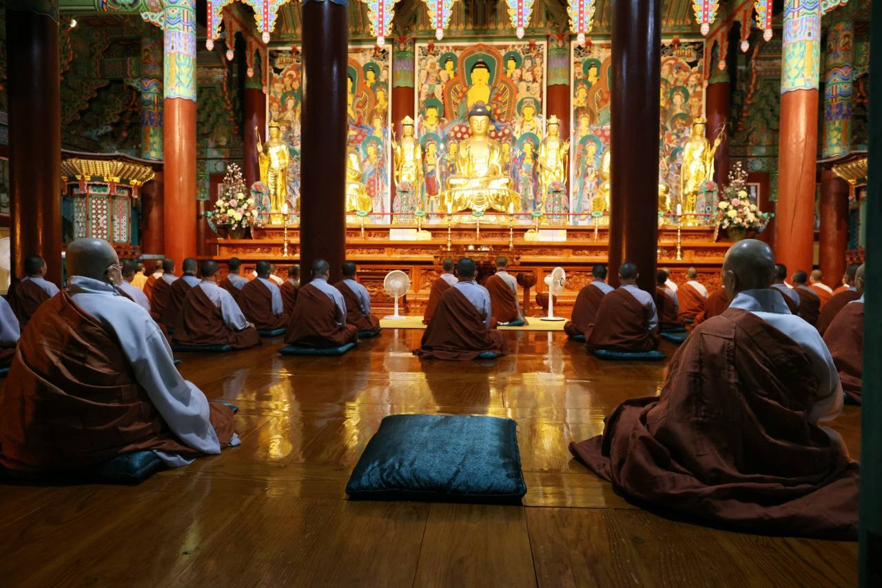 Nuns pray inside Daeungjeon building, designated as Korea’s National Treasure No. 835, at the Unmunsa Buddhist Nunnery University in Korea. (Hyungwon Kang)